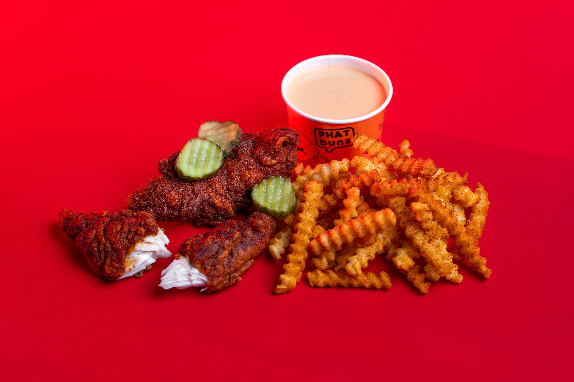 PHATVille hot chicken, pickles, fries and dip on red